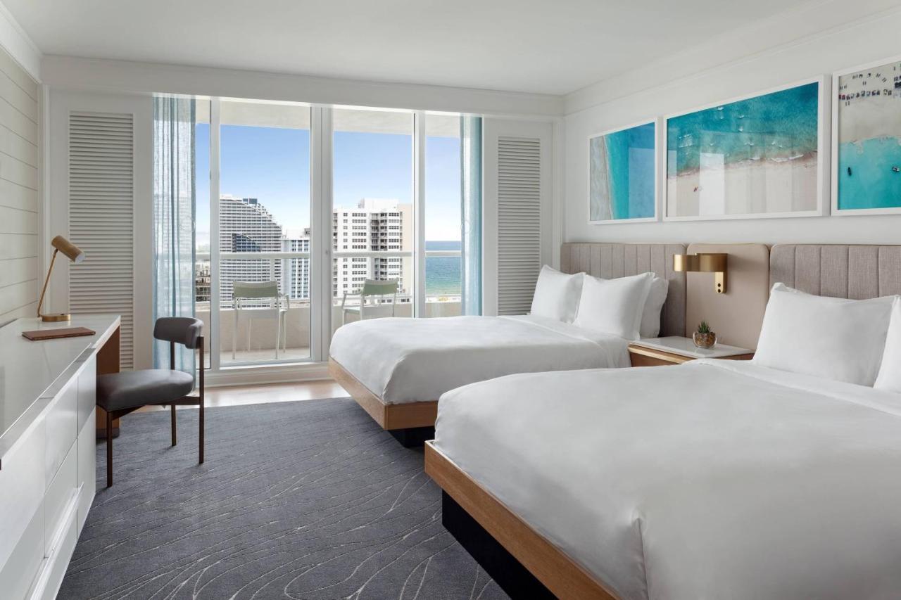 Guest Room Two Double Beds Balcony Partial Ocean View